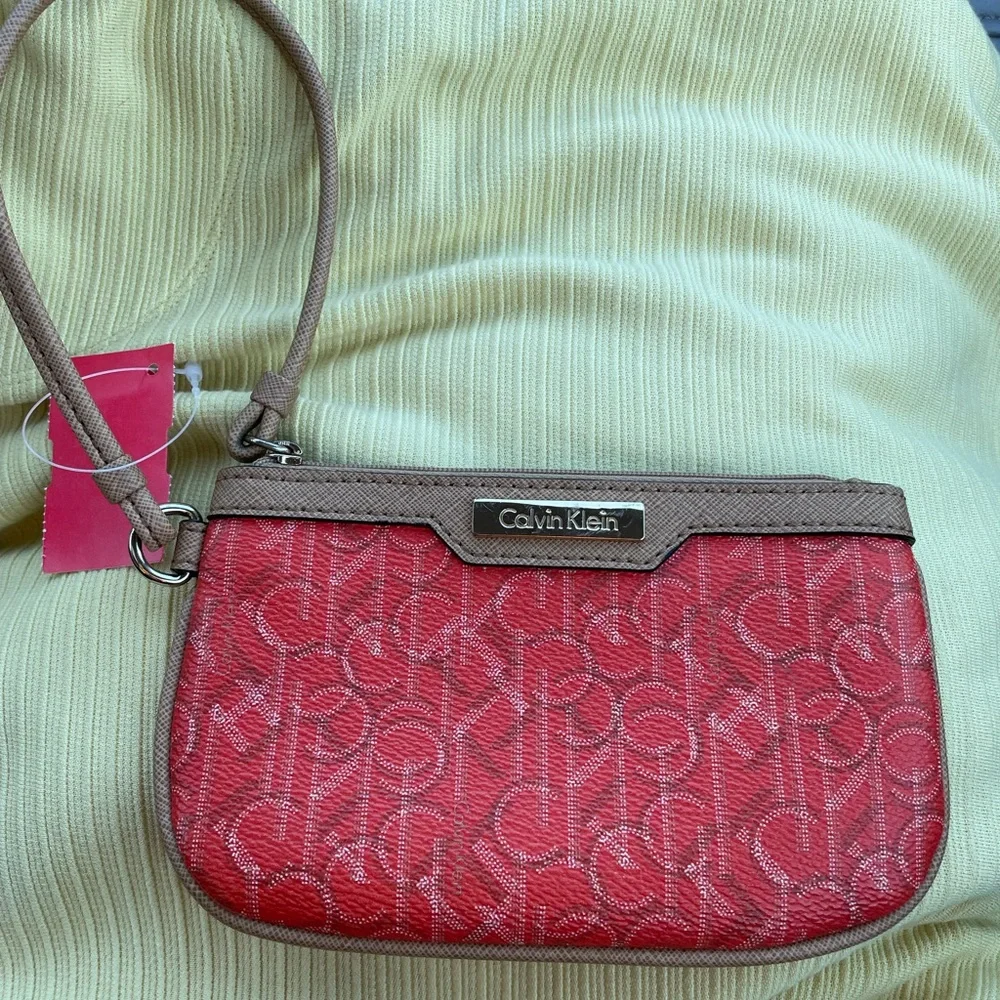 Calvin Klein Wristlet Women’s zipper coin purse 5x7‎ Orange W/Tan Trim w/CK logo